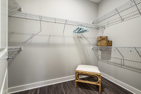 Cozy bedroom with modern decor and large windows at Element Barclay Station luxury apartments