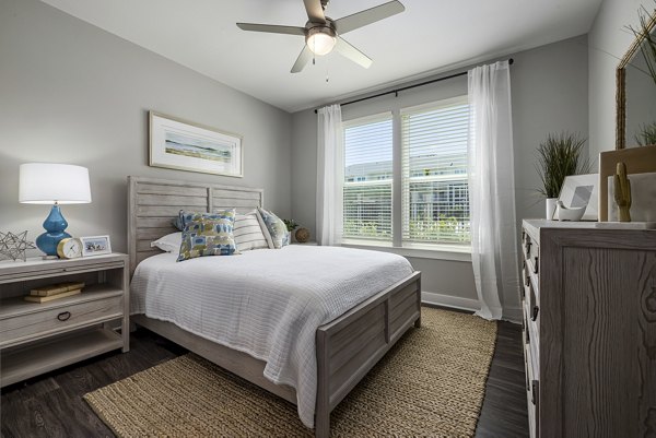 Contemporary bedroom with chic decor at Element Barclay Station luxury apartments, offering comfort and style