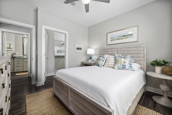Cozy bedroom with modern furnishings at Element Barclay Station apartments