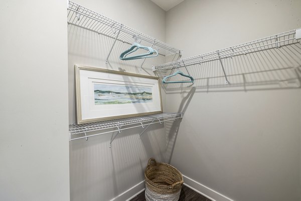 Cozy bedroom with modern decor at Element Barclay Station apartments, offering luxury living options for residents
