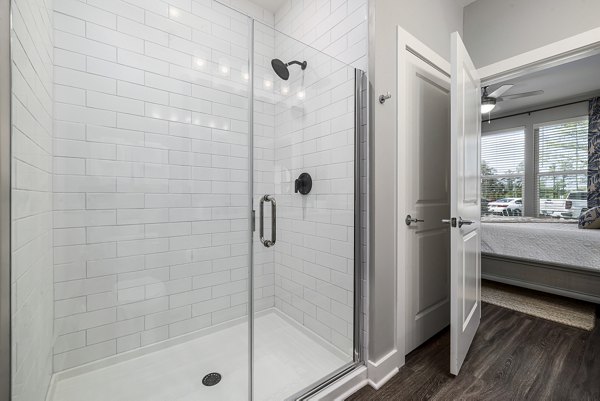 Spacious bathroom featuring sleek fixtures and modern design at Element Barclay Station luxury apartments