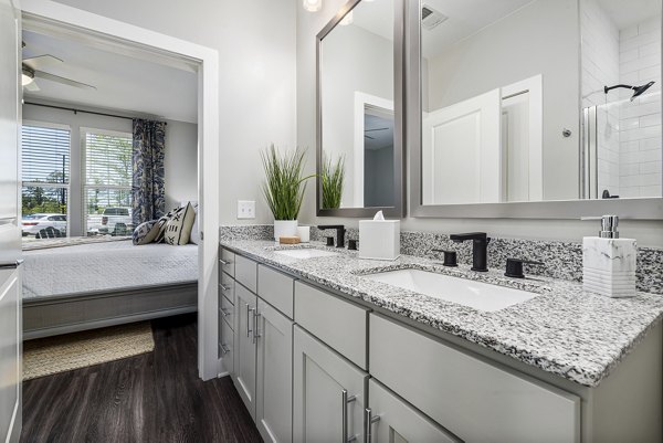 Luxurious bathroom with modern fixtures at Element Barclay Station apartments
