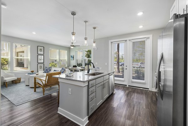 Modern kitchen featuring stainless steel appliances at Element Barclay Station luxury apartments