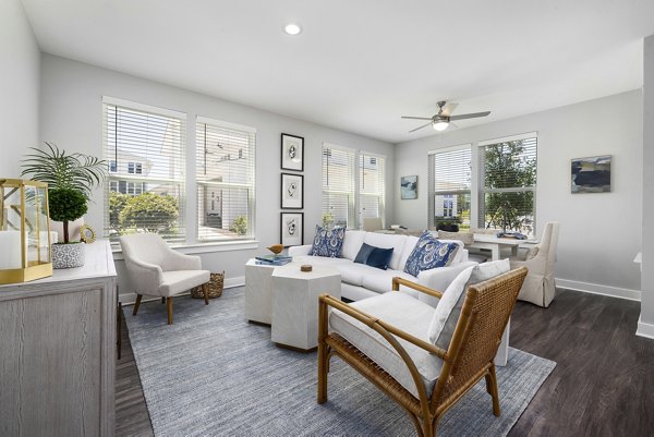 Living room with chic decor and open layout at Element Barclay Station apartments