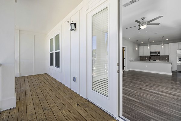 Spacious patio with modern furniture at Element Barclay Station apartments, perfect for outdoor relaxation and entertaining guests