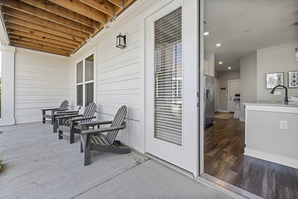 Modern outdoor patio with stylish seating at Element Barclay Station, a luxury apartment community
