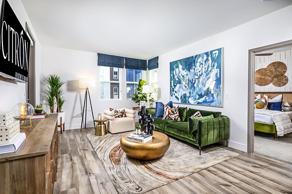 Spacious living room with modern decor and large windows at Citron Apartments