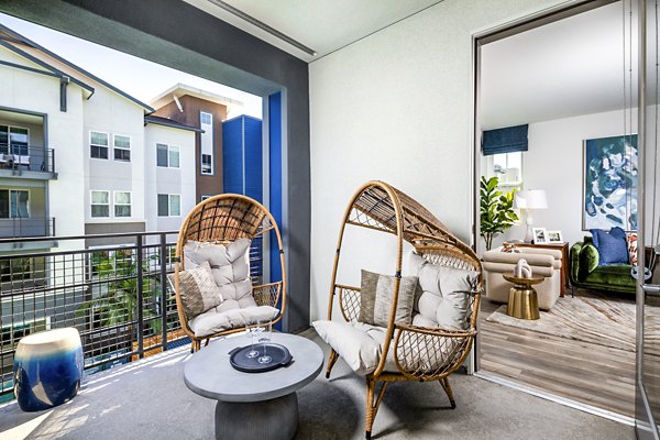 Patio with modern furnishings at Citron Apartments A serene outdoor space for relaxation and city views