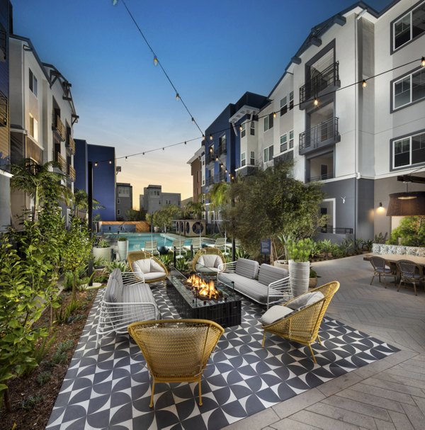 Cozy fire pit area in Citron Apartments courtyard, perfect for outdoor gatherings and relaxation