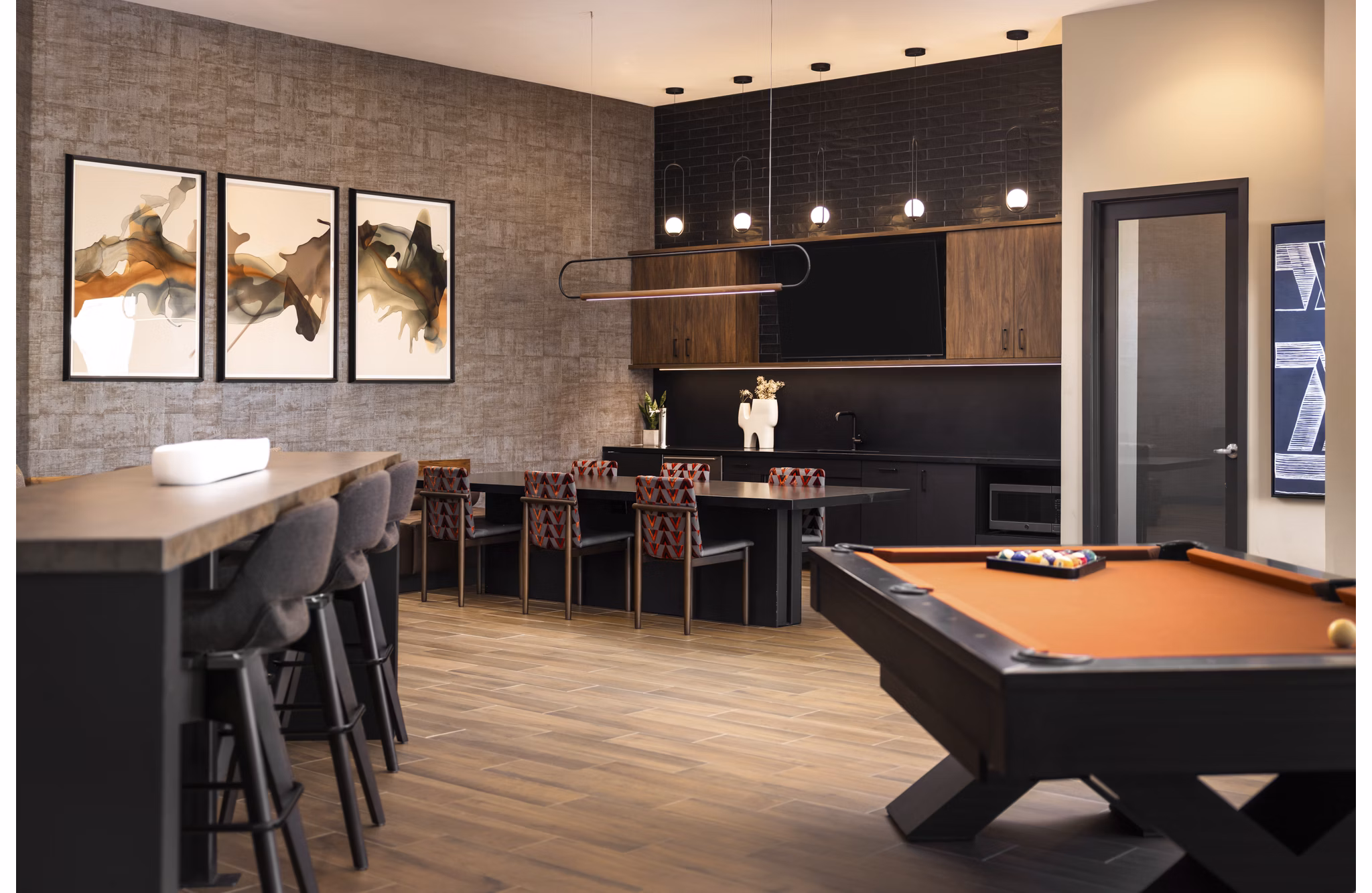 Contemporary clubhouse with lounge seating at Fieldhouse Apartments offering luxury amenities and community spaces
