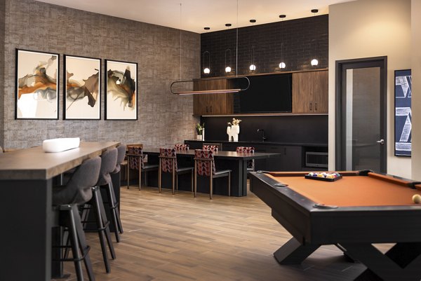 Contemporary clubhouse with lounge seating at Fieldhouse Apartments offering luxury amenities and community spaces