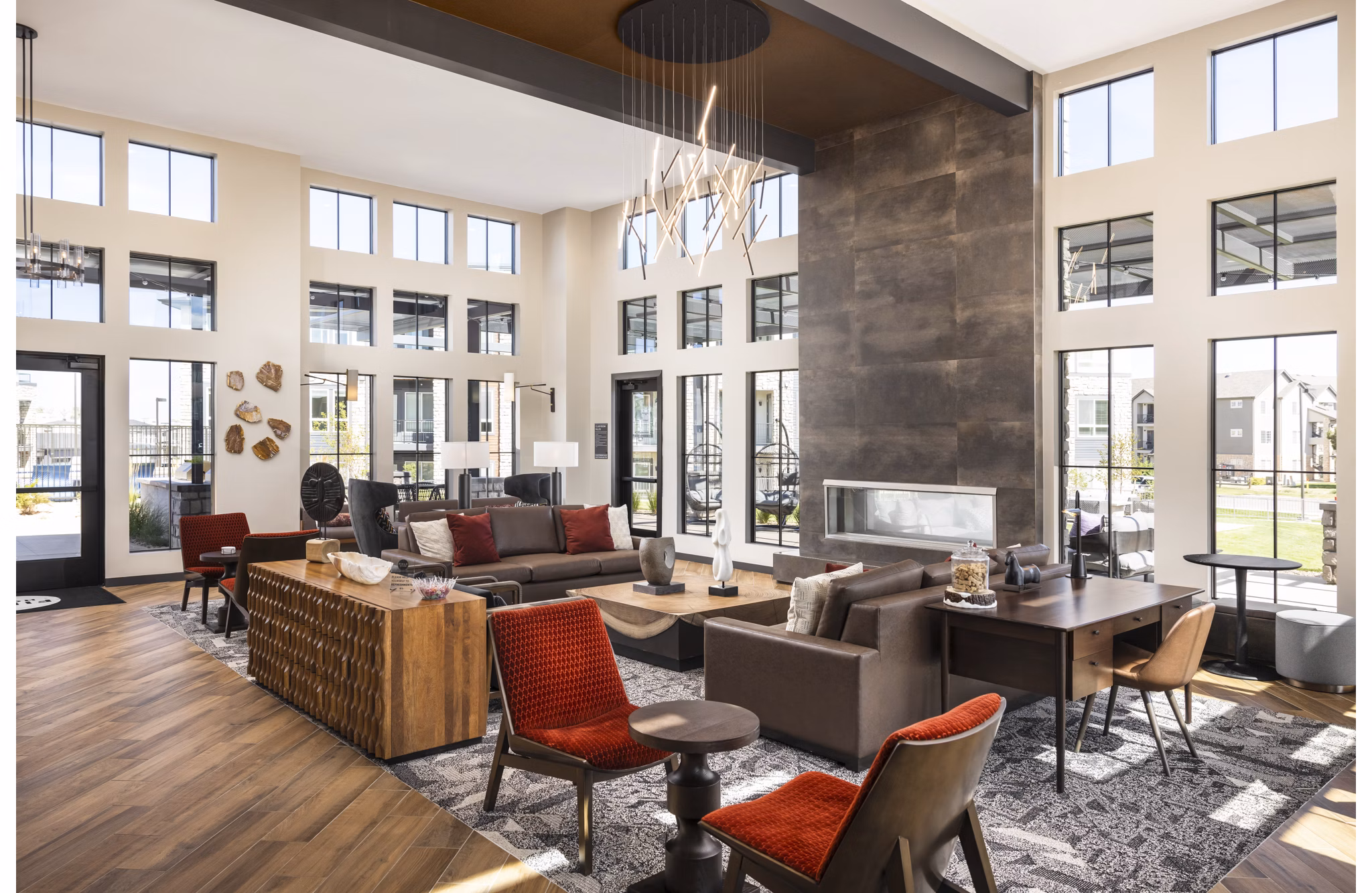 Fieldhouse Apartments: Modern clubhouse with stylish seating and entertainment areas