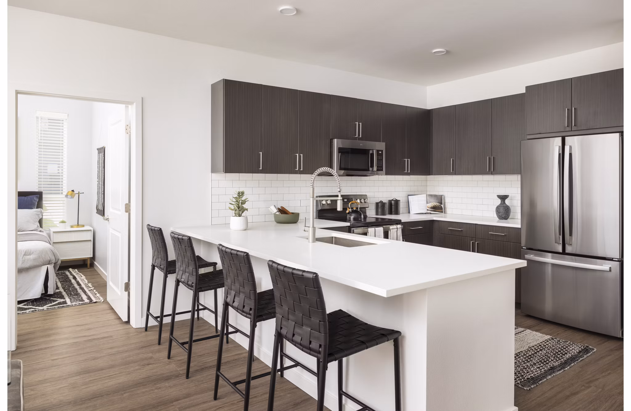Modern clubhouse featuring cozy seating and fireplace at Fieldhouse Apartments, luxury living space