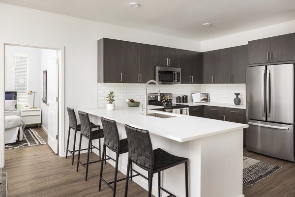 Modern clubhouse featuring cozy seating and fireplace at Fieldhouse Apartments, luxury living space