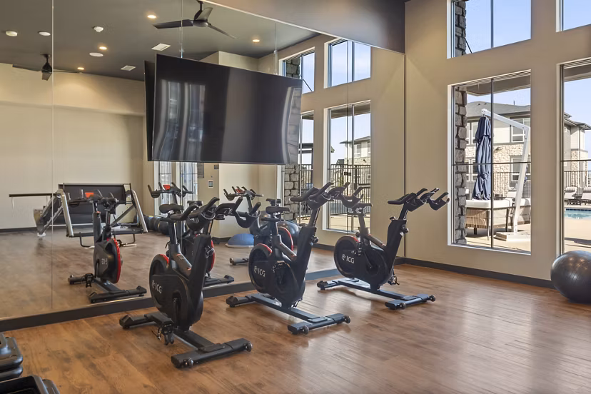 Fitness center with modern equipment at Fieldhouse Apartments