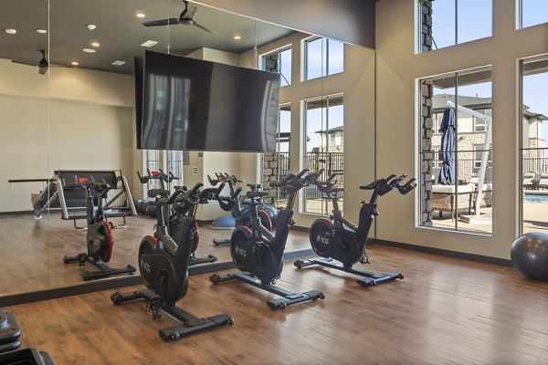 Fitness center with modern equipment at Fieldhouse Apartments