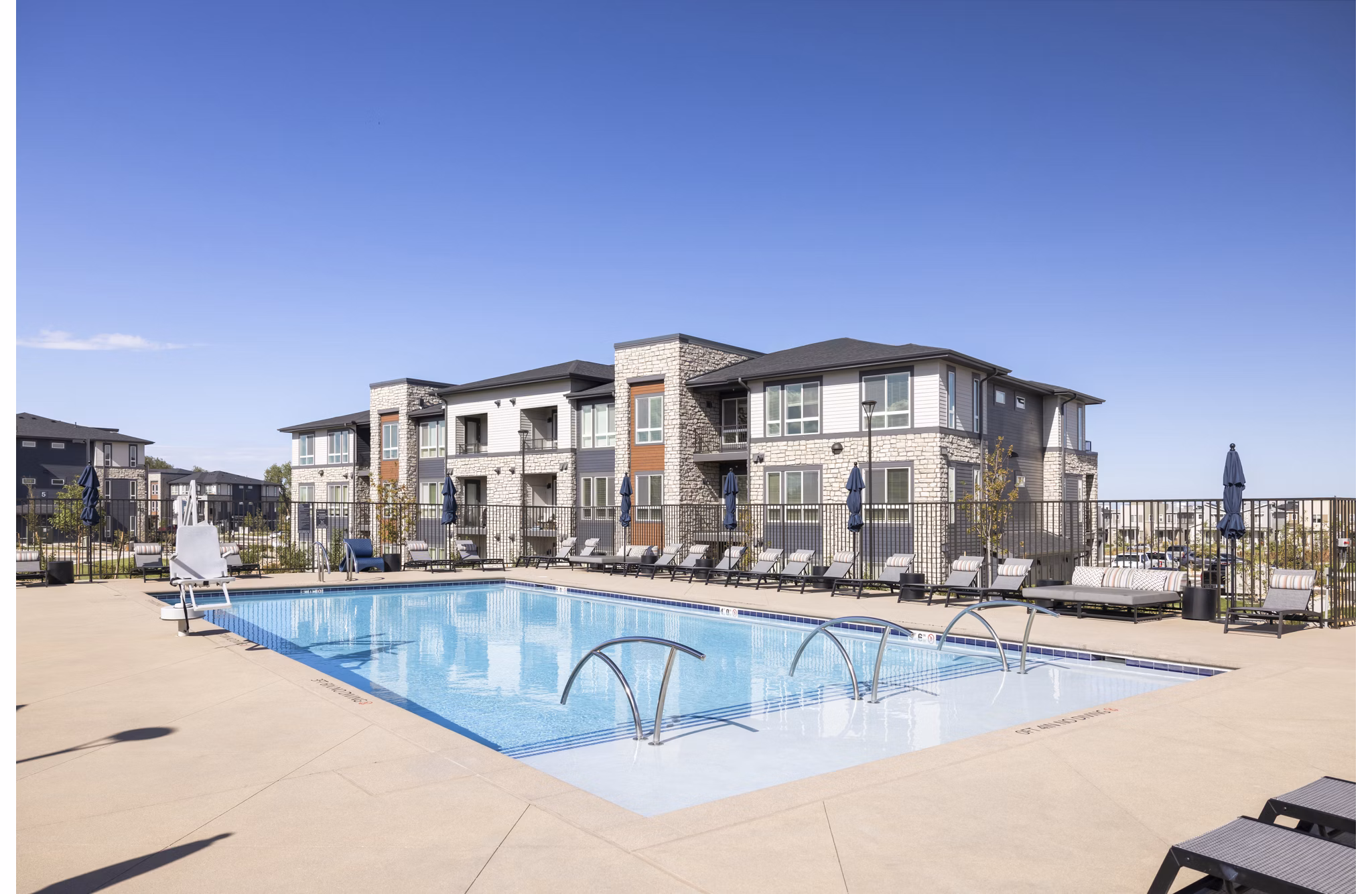 In sunny pool area at Fieldhouse Apartments, by Greystar