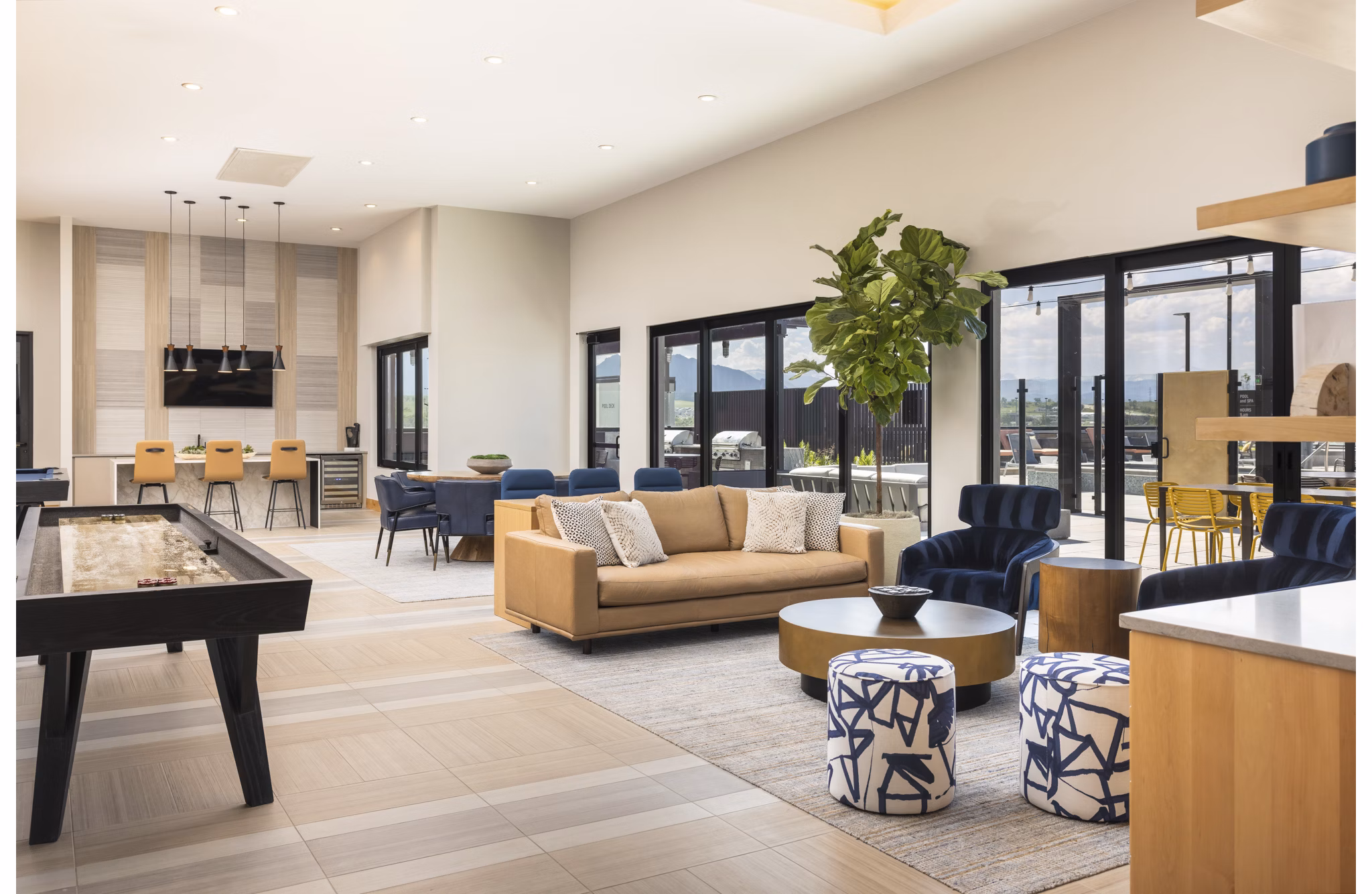 Clubhouse featuring modern design and comfortable seating at Origin Apartments