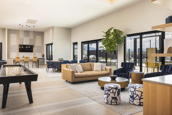 Clubhouse featuring modern design and comfortable seating at Origin Apartments