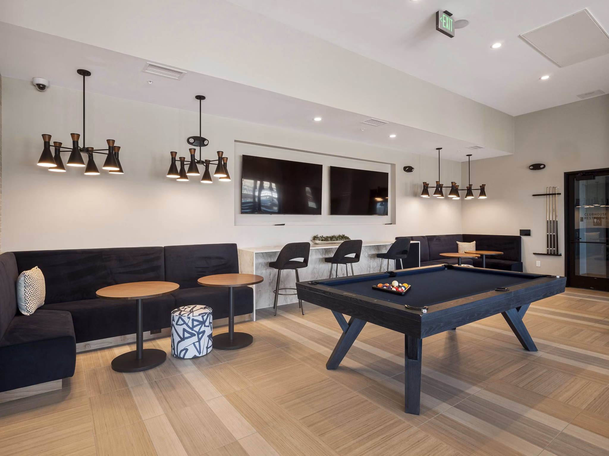 Modern clubhouse with stylish seating and communal workspaces at Origin Apartments