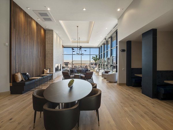 Clubhouse featuring modern dÃ©cor and seating at Origin Apartments in a Greystar luxury community Ideal for social gatherings and relaxation
