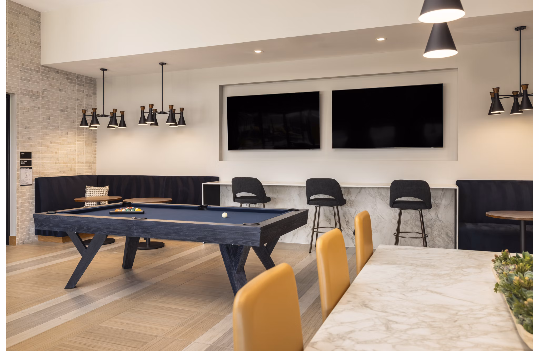 Clubhouse featuring modern design and cozy seating at Origin Apartments in downtown Seattle