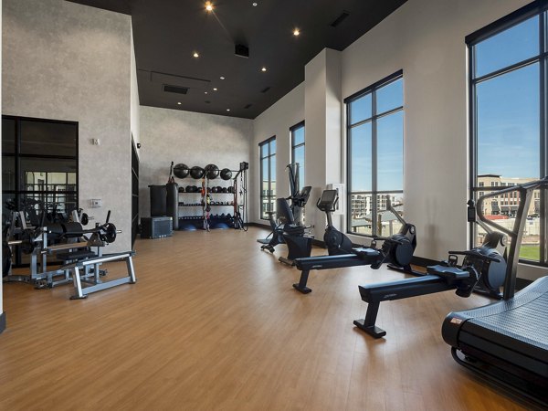 Modern fitness center featuring top-tier equipment at Origin Apartments