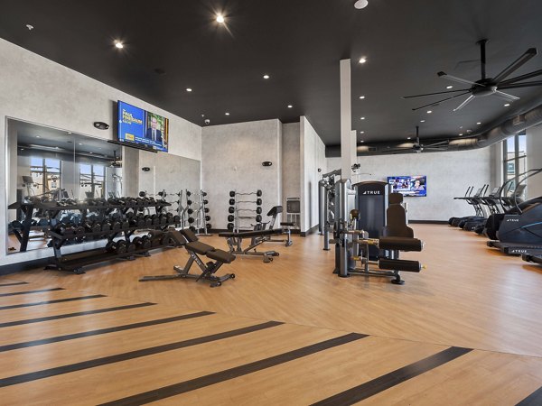 State-of-the-art fitness center at Origin Apartments featuring modern equipment and spacious workout areas