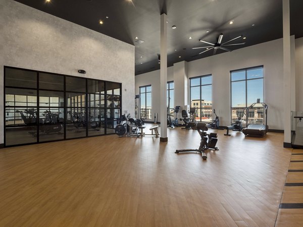Serene yoga and spin studio featuring modern equipment at Origin Apartments