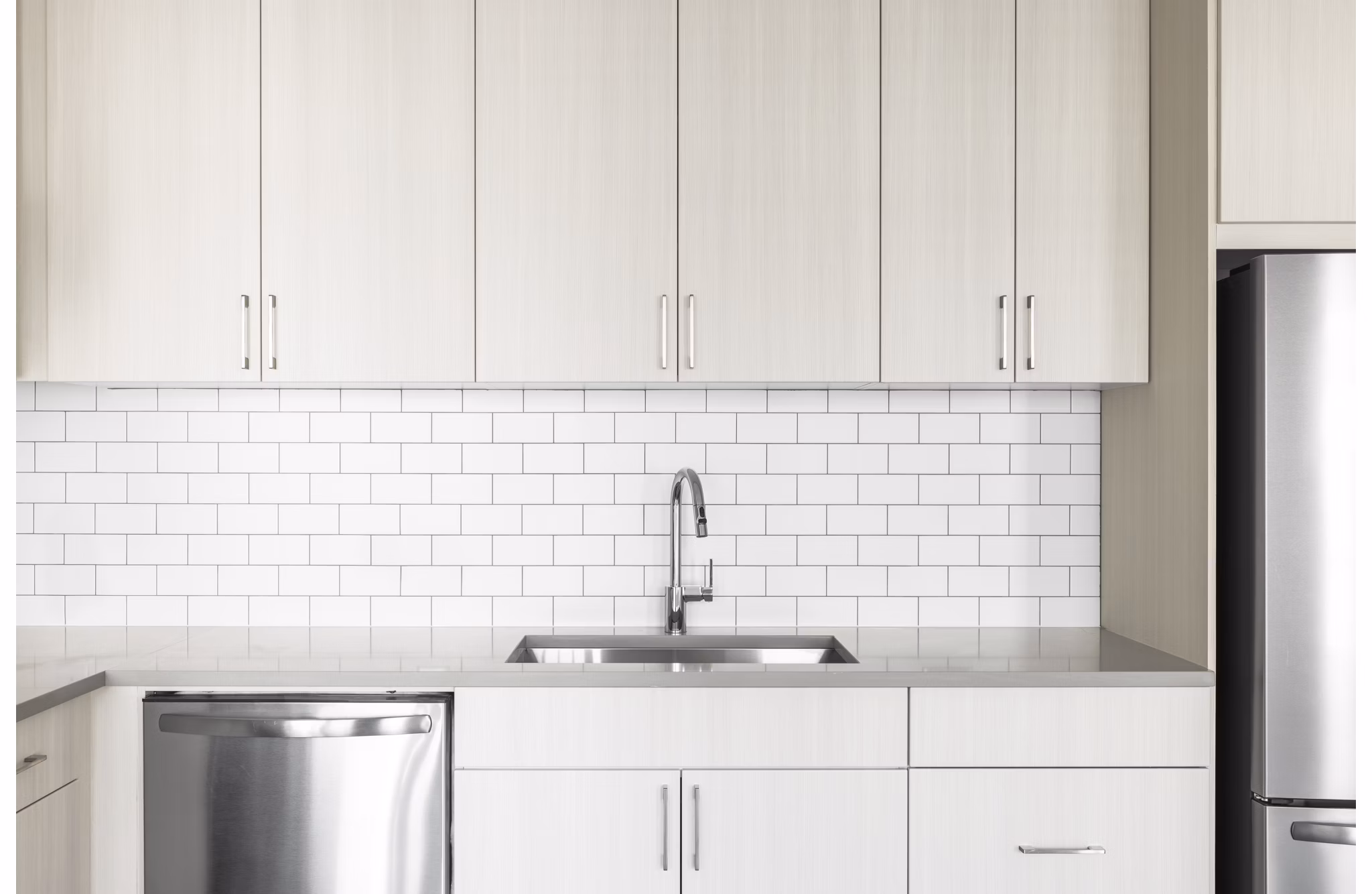 Modern kitchen with stainless steel appliances at Origin Apartments