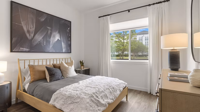 Cozy bedroom with soft lighting and modern decor at Infield Apartments