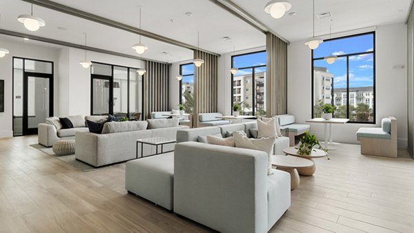 Infield Apartments: Modern clubhouse with inviting seating areas and contemporary decor