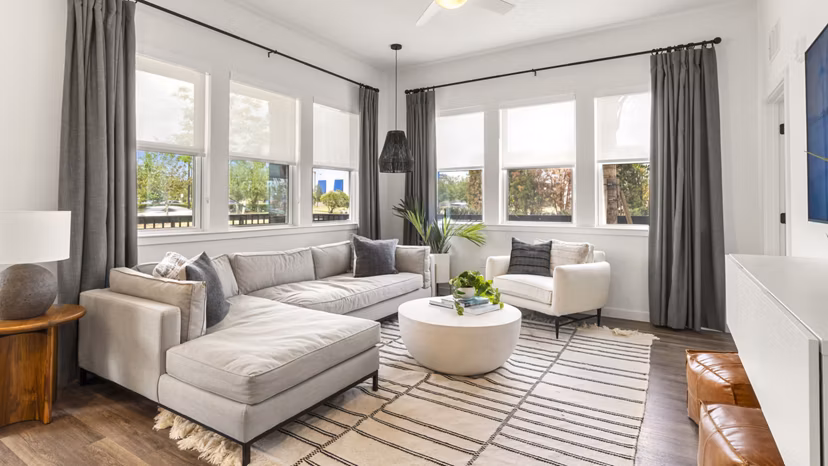Spacious living room with contemporary design elements in Infield Apartments