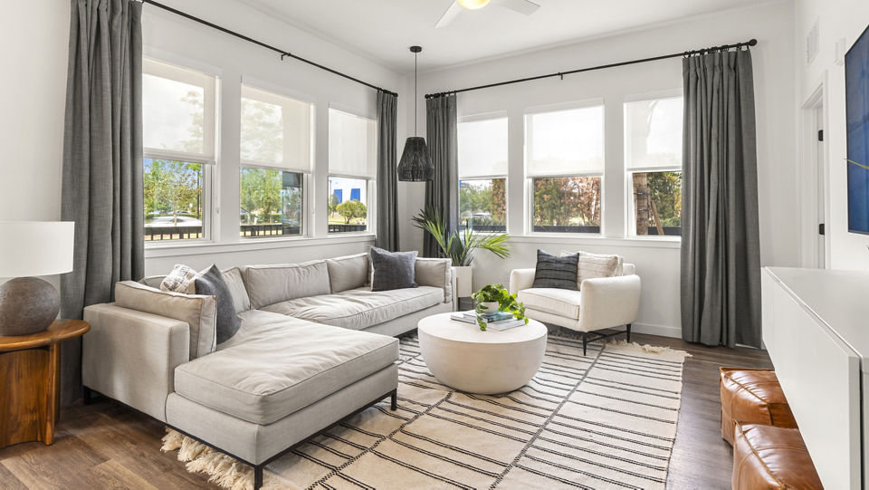 Spacious living room with contemporary design elements in Infield Apartments
