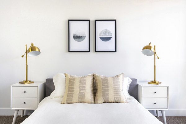 Cozy bedroom with modern decor in The LC Apartments