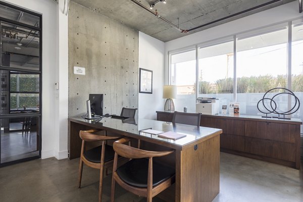 Clubhouse with modern design at The LC Apartments, featuring luxury amenities for residents to enjoy social gatherings and relaxation spaces