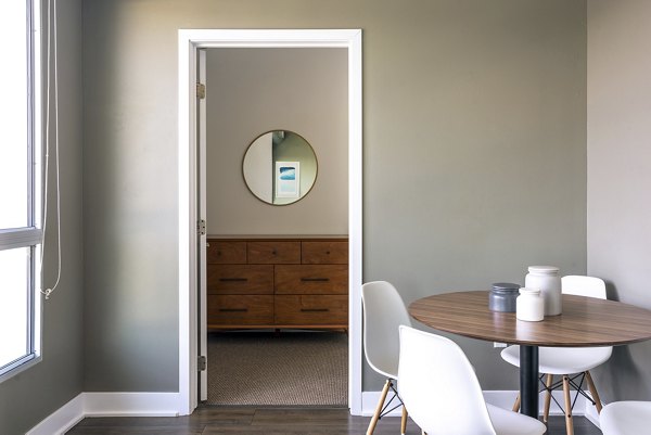 Dining area showcasing modern furnishings and elegant decor at The LC Apartments