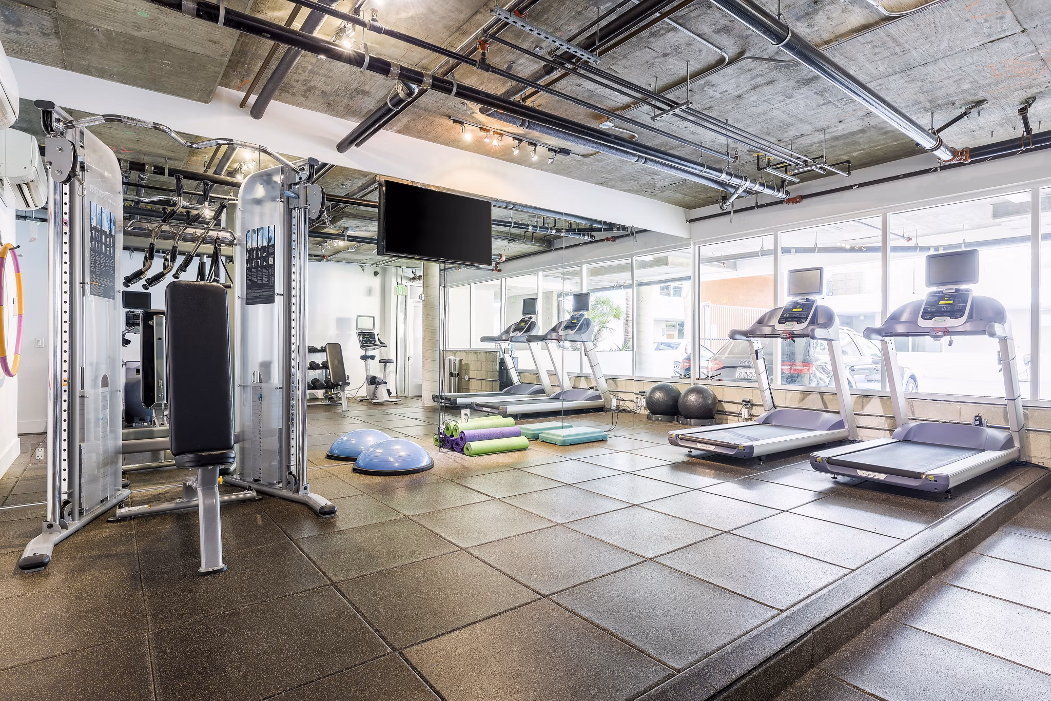 State-of-the-art fitness center with modern equipment at The LC Apartments