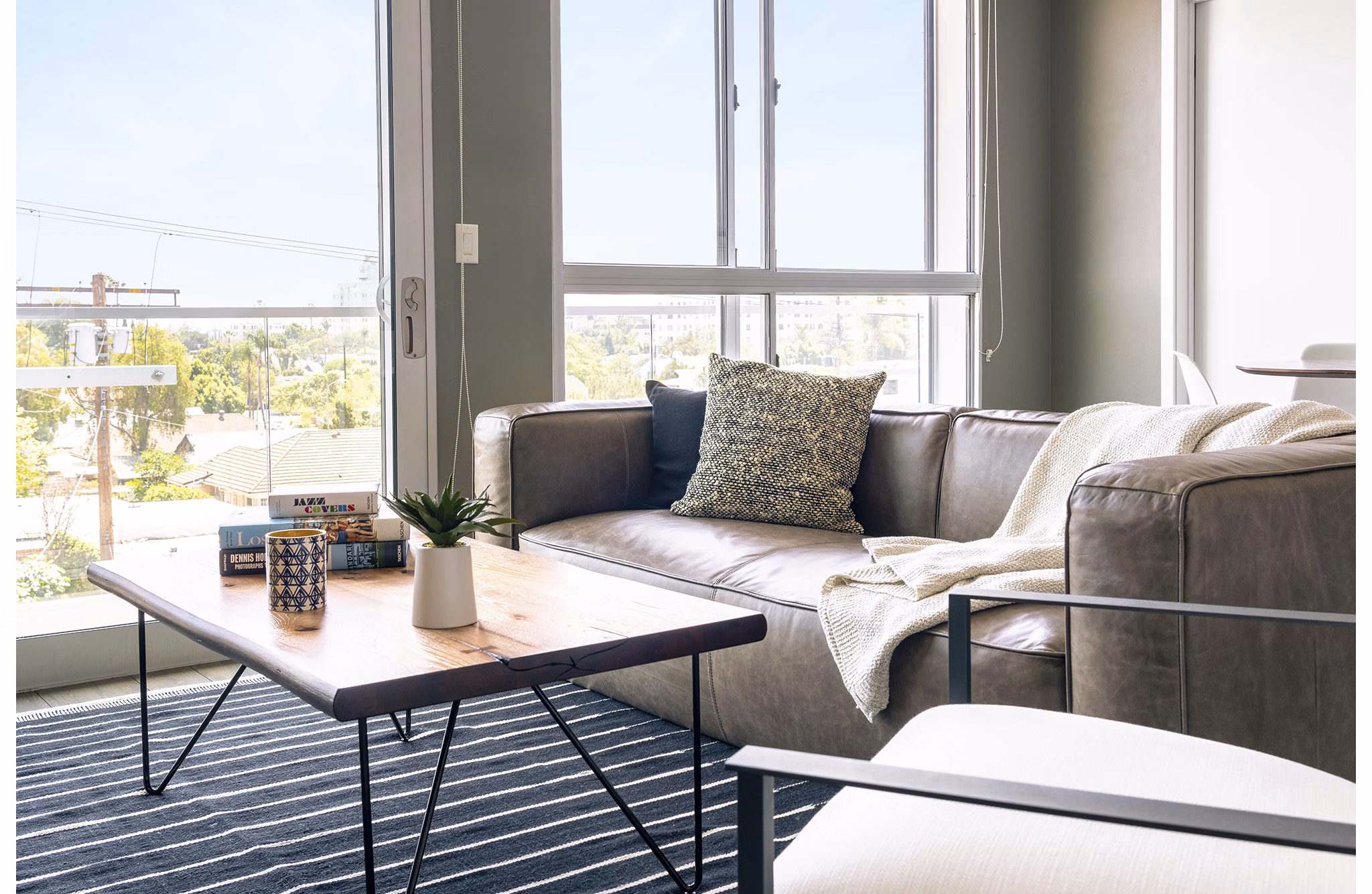 Spacious living room with modern design elements at The LC Apartments