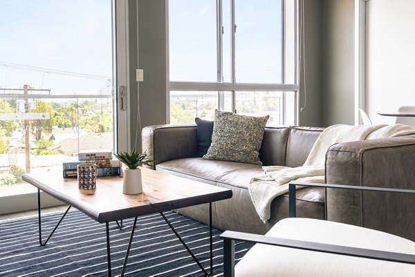 Spacious living room with modern design elements at The LC Apartments