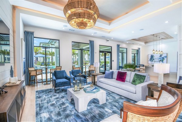 Stylish clubhouse at Ltd Champions Ridge Apartments featuring cozy seating and modern decor