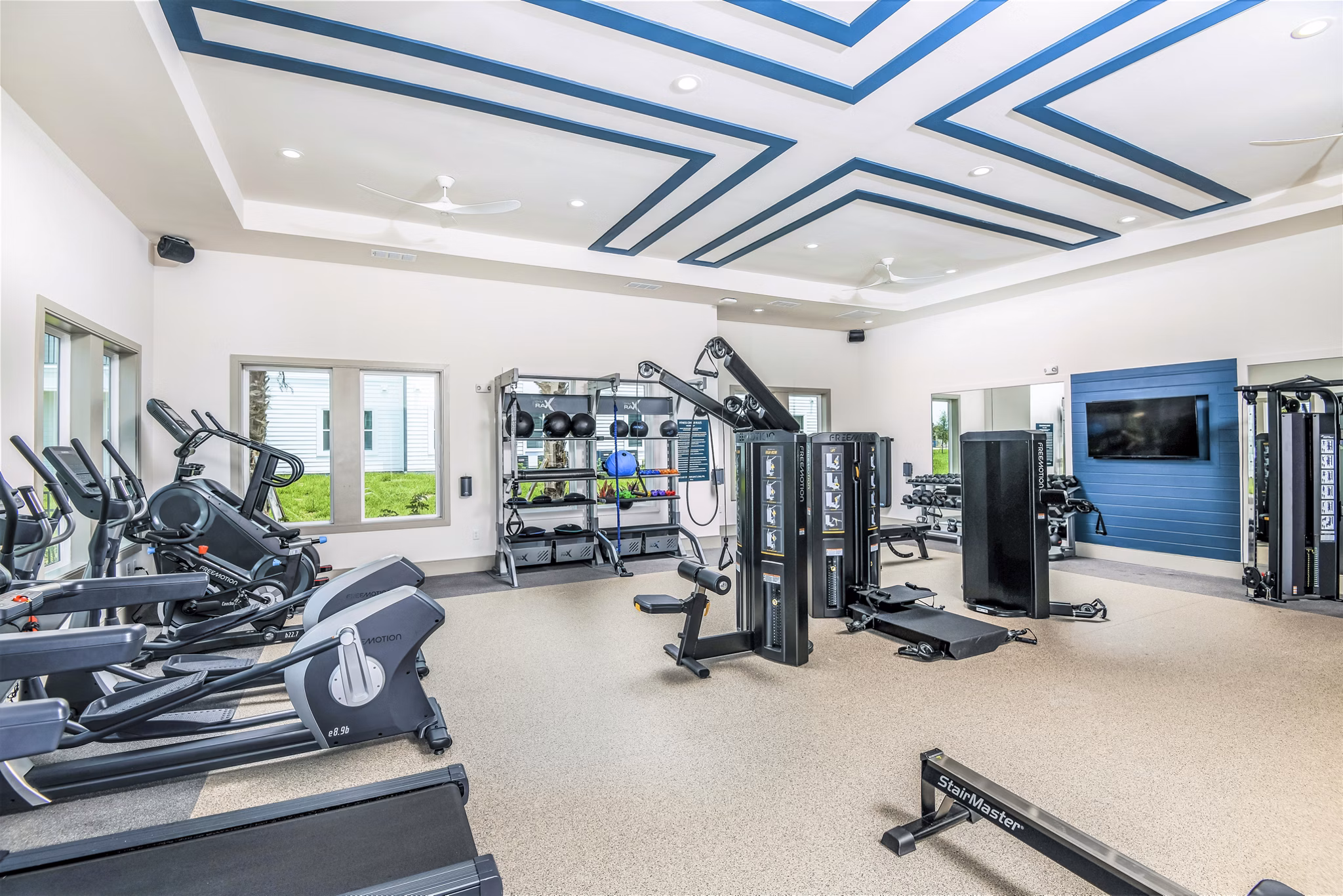 Fitness center with modern equipment at Ltd Champions Ridge Apartments