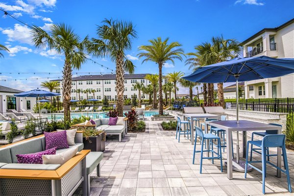 Patio with modern seating at Ltd Champions Ridge Apartments in Austin