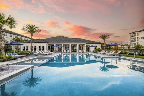 Resort-style pool with lounge seating at Ltd Champions Ridge Apartments, perfect for relaxation and leisure