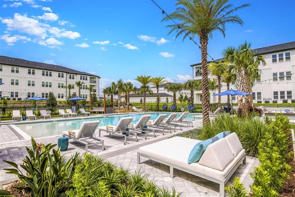 Resort-style pool at Champions Ridge Apartments, a luxury rental community