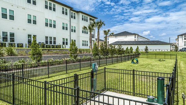 Expansive dog park at Ltd Champions Ridge Apartments offering ample space for pets to play and socialize