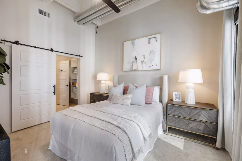 Cozy bedroom with modern decor at Elev8 Apartments