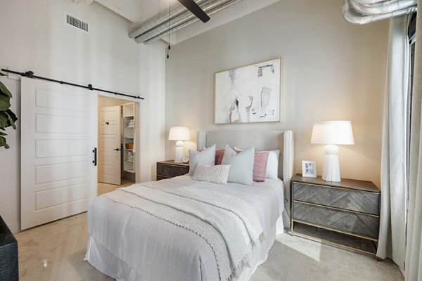 Cozy bedroom with modern decor at Elev8 Apartments