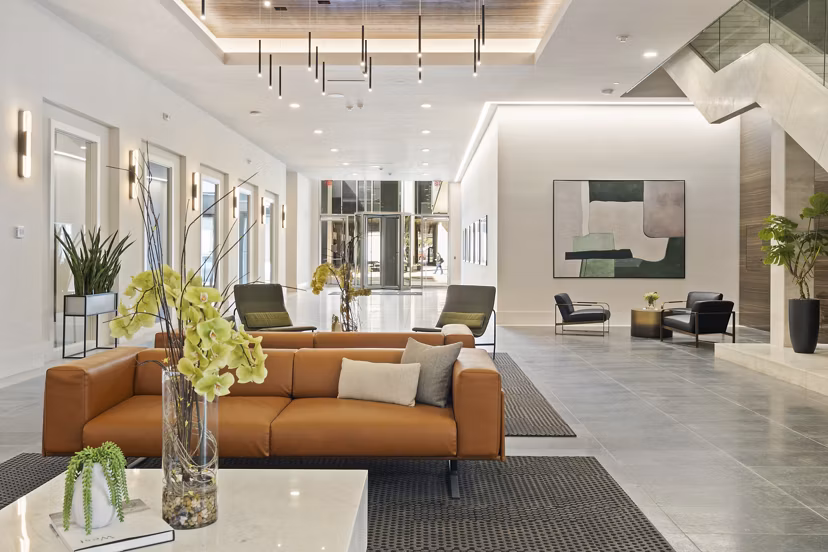 Elegant modern clubhouse at Elev8 Apartments featuring cozy seating and stylish decor, offering a luxurious gathering space for residents