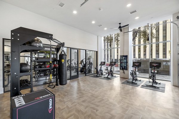 Modern fitness center with state-of-the-art equipment at Elev8 Apartments, perfect for active residents seeking a healthy lifestyle